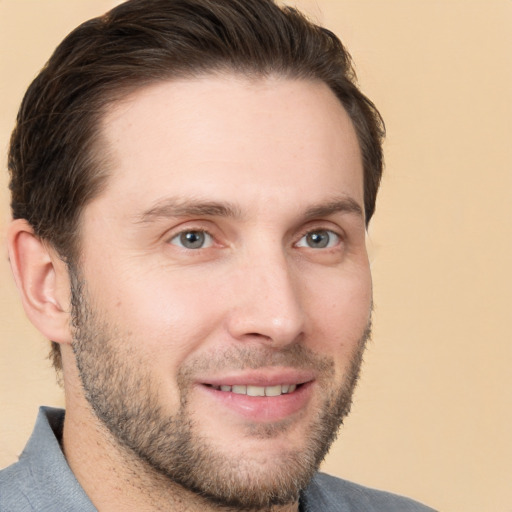 Joyful white young-adult male with short  brown hair and brown eyes