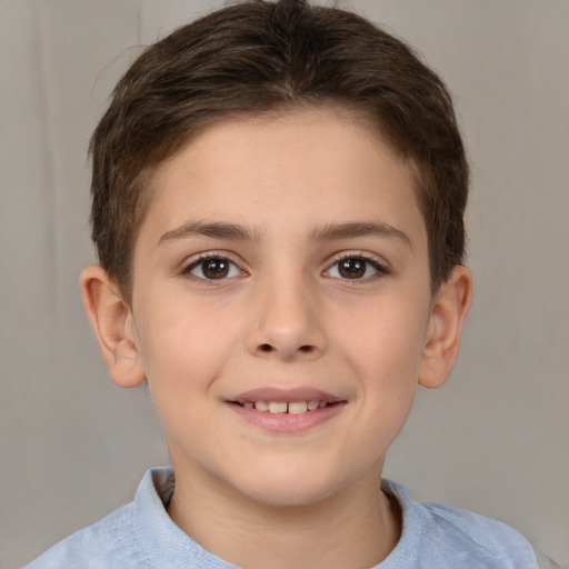 Joyful white child female with short  brown hair and brown eyes