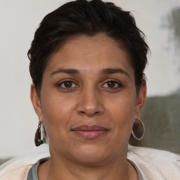 Joyful white adult female with short  brown hair and brown eyes