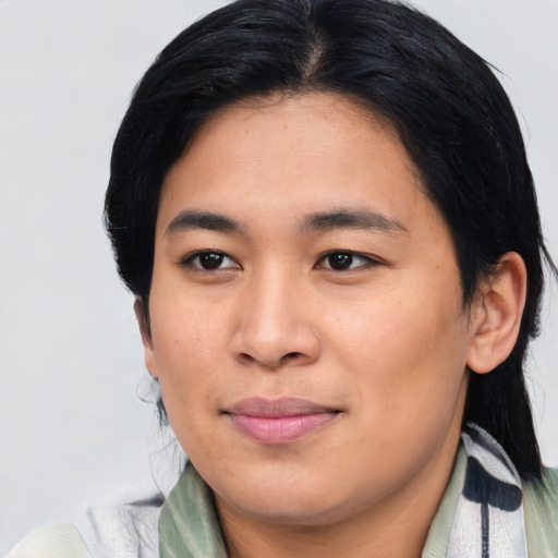 Joyful asian young-adult female with medium  black hair and brown eyes