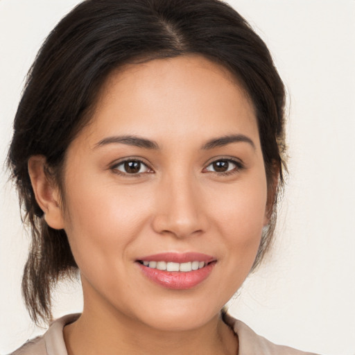 Joyful white young-adult female with medium  brown hair and brown eyes