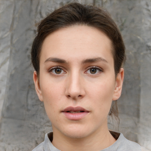 Neutral white young-adult female with short  brown hair and brown eyes