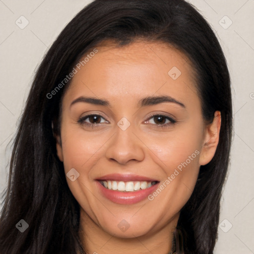 Joyful latino young-adult female with long  brown hair and brown eyes