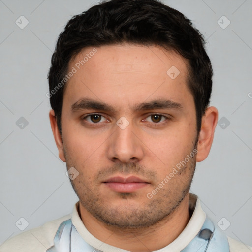 Neutral white young-adult male with short  black hair and brown eyes