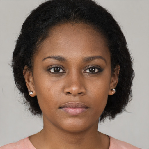 Neutral black young-adult female with short  black hair and brown eyes