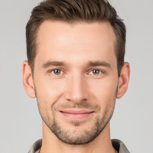 Joyful white young-adult male with short  brown hair and brown eyes