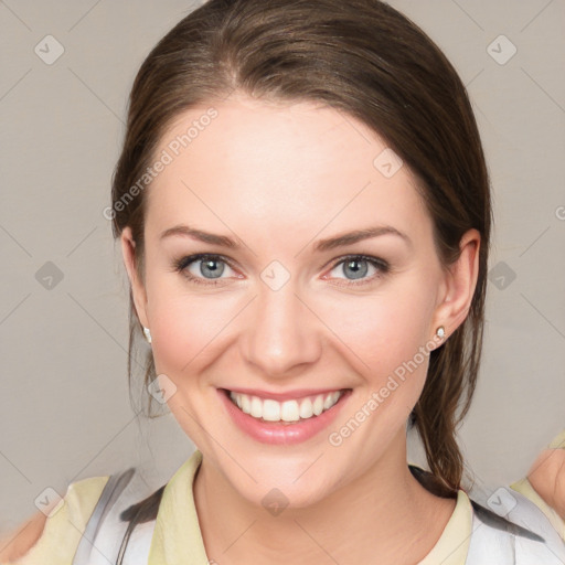 Joyful white young-adult female with medium  brown hair and blue eyes