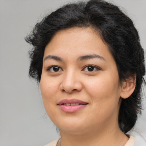 Joyful asian young-adult female with medium  brown hair and brown eyes