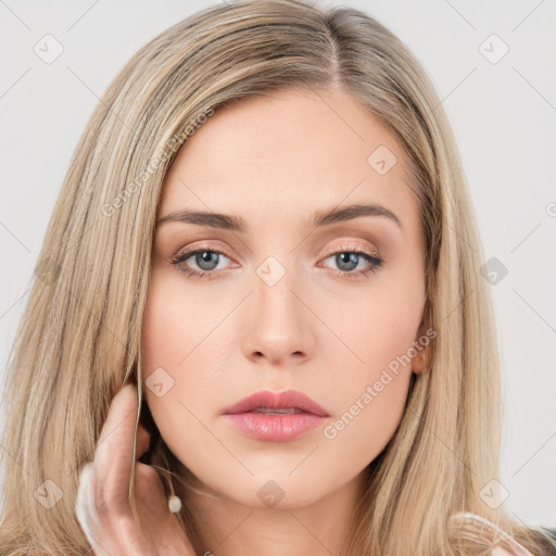 Neutral white young-adult female with long  brown hair and brown eyes