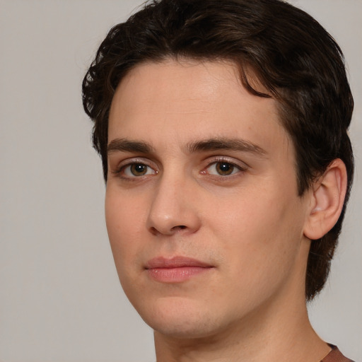 Joyful white young-adult male with medium  brown hair and brown eyes