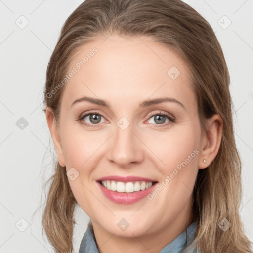 Joyful white young-adult female with long  brown hair and blue eyes