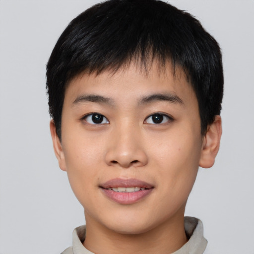 Joyful asian young-adult male with short  brown hair and brown eyes