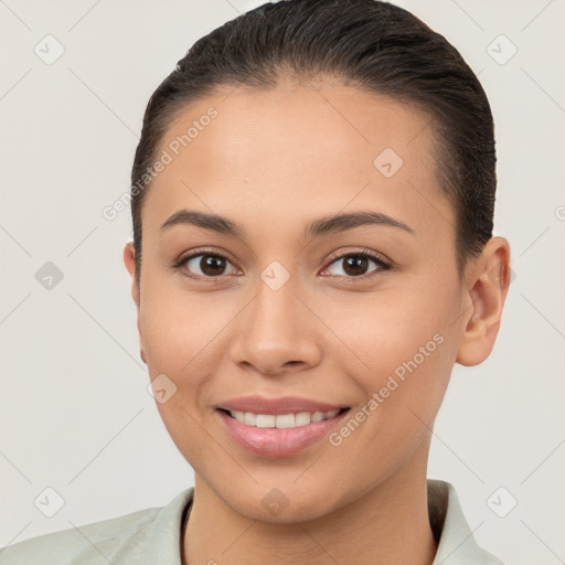 Joyful white young-adult female with short  brown hair and brown eyes