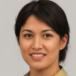 Joyful asian young-adult female with medium  brown hair and brown eyes