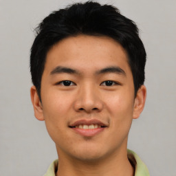 Joyful asian young-adult male with short  black hair and brown eyes