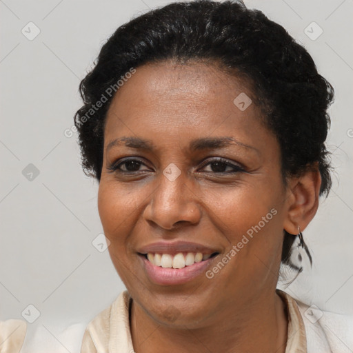 Joyful black young-adult female with medium  brown hair and brown eyes