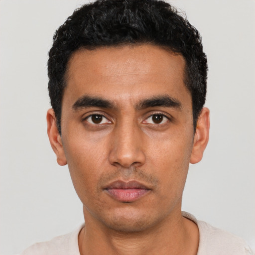 Neutral latino young-adult male with short  black hair and brown eyes