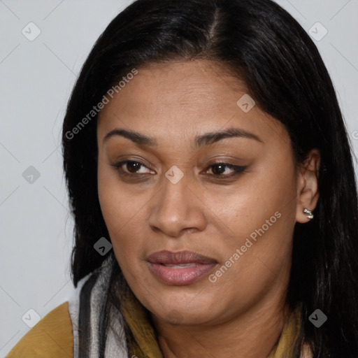 Joyful latino young-adult female with long  brown hair and brown eyes