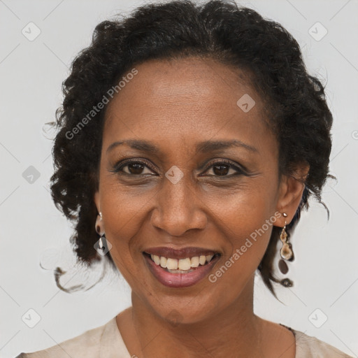 Joyful black adult female with short  brown hair and brown eyes