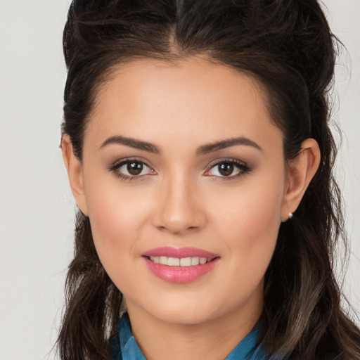 Joyful white young-adult female with long  brown hair and brown eyes