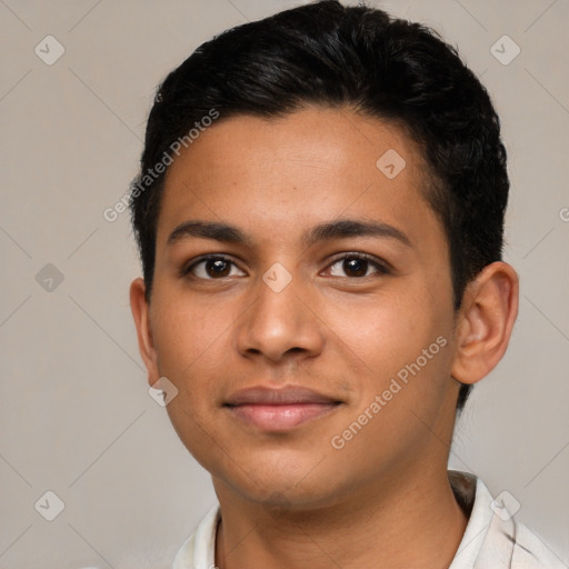 Joyful latino young-adult male with short  brown hair and brown eyes