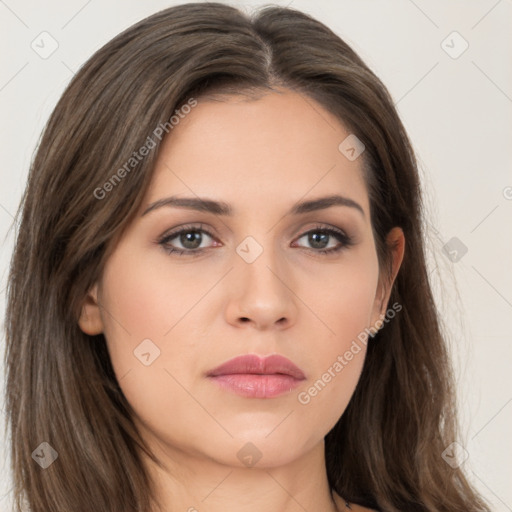 Neutral white young-adult female with long  brown hair and brown eyes