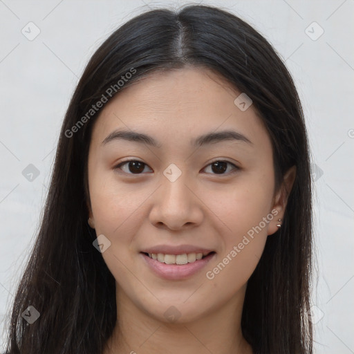 Joyful asian young-adult female with long  brown hair and brown eyes