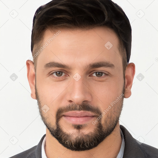 Joyful white young-adult male with short  brown hair and brown eyes