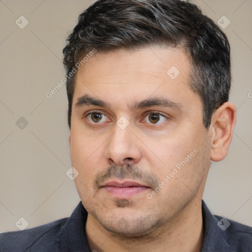 Neutral white adult male with short  black hair and brown eyes