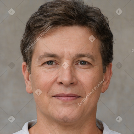 Joyful white adult male with short  brown hair and brown eyes