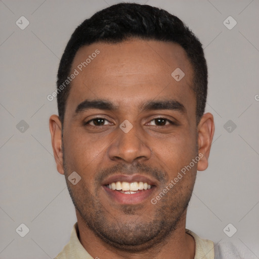 Joyful black young-adult male with short  black hair and brown eyes