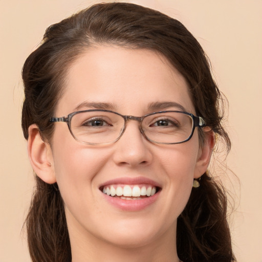 Joyful white young-adult female with medium  brown hair and brown eyes