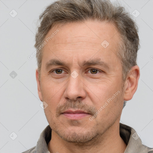 Neutral white adult male with short  brown hair and brown eyes