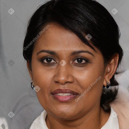 Joyful black adult female with medium  brown hair and brown eyes