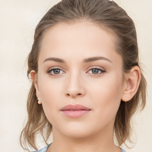 Neutral white young-adult female with medium  brown hair and grey eyes