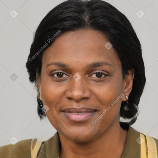 Joyful black adult female with short  brown hair and brown eyes