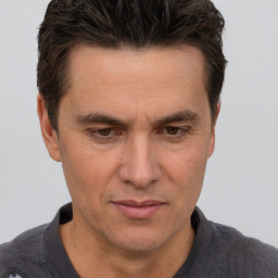 Neutral white adult male with short  brown hair and brown eyes