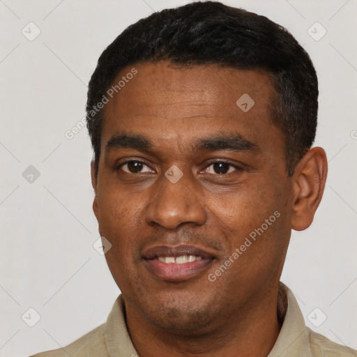 Joyful latino young-adult male with short  black hair and brown eyes