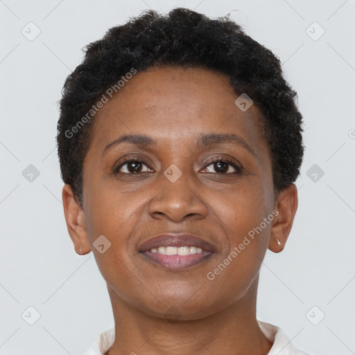 Joyful black adult female with short  brown hair and brown eyes