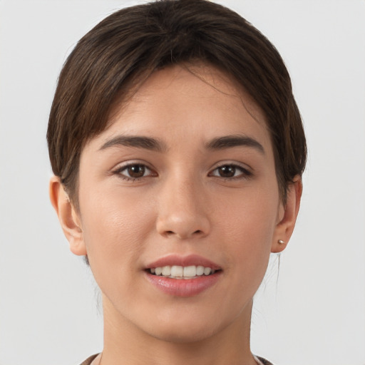 Joyful white young-adult female with short  brown hair and brown eyes