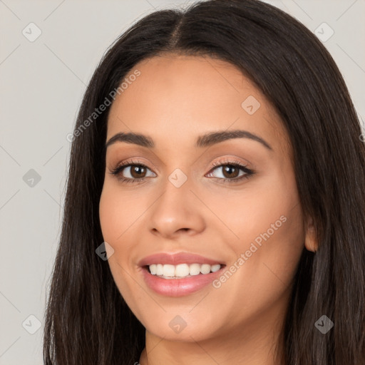 Joyful white young-adult female with long  black hair and brown eyes