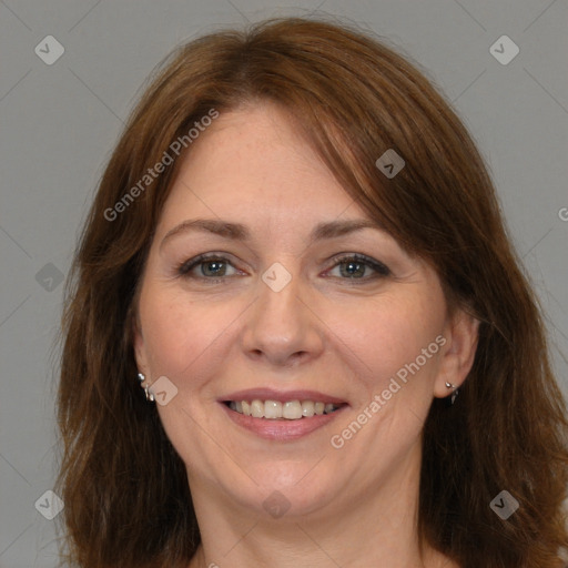 Joyful white adult female with long  brown hair and brown eyes