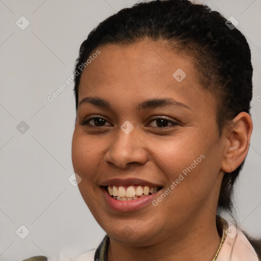 Joyful latino young-adult female with short  brown hair and brown eyes