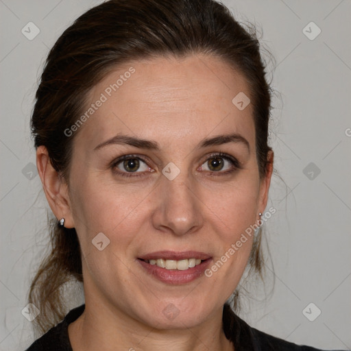 Joyful white adult female with medium  brown hair and grey eyes