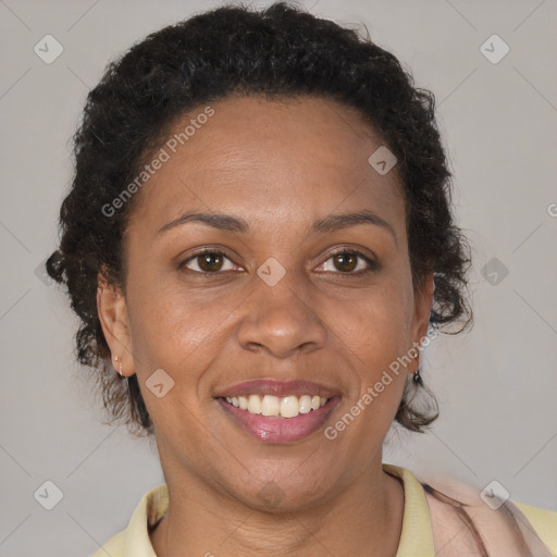 Joyful black adult female with short  brown hair and brown eyes