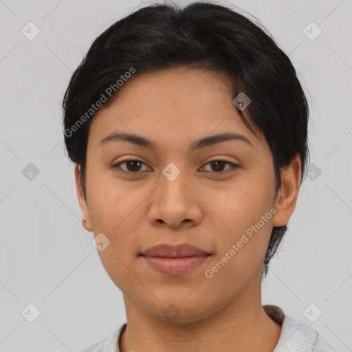 Joyful latino young-adult female with short  brown hair and brown eyes