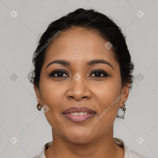 Joyful latino young-adult female with medium  brown hair and brown eyes