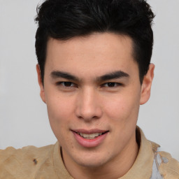 Joyful asian young-adult male with short  brown hair and brown eyes