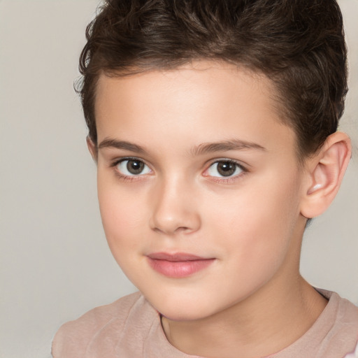 Joyful white child female with short  brown hair and brown eyes