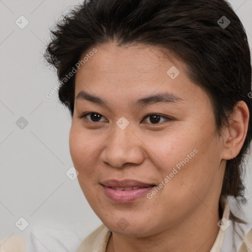 Joyful white young-adult female with medium  brown hair and brown eyes